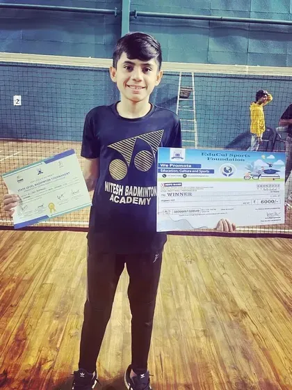Academy player Dev Ruparelia celebrating tournament championship victory